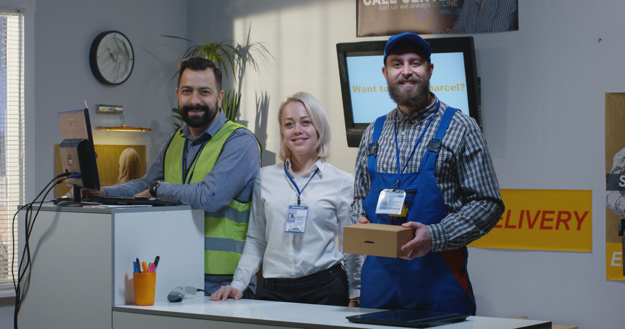Delivery center employees standing by desk