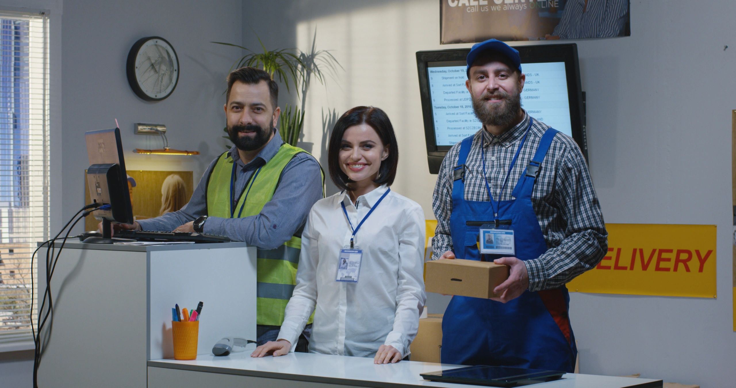 Courier office team standing together at service desk