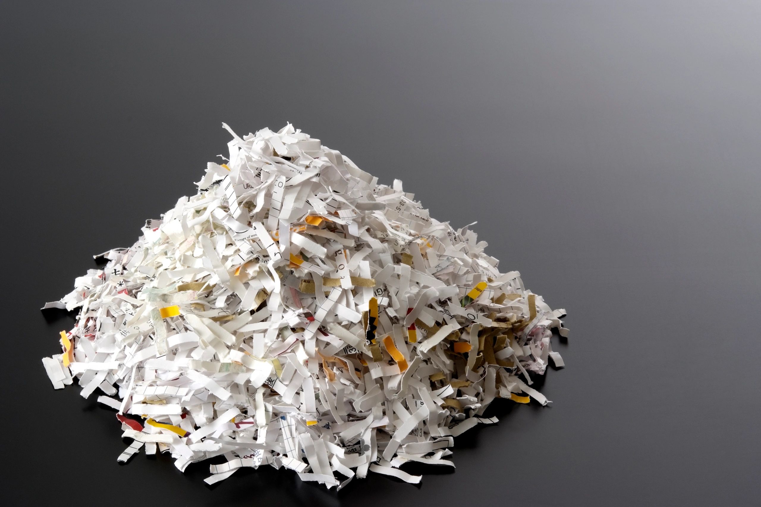 Shredded documents representing secure data disposal