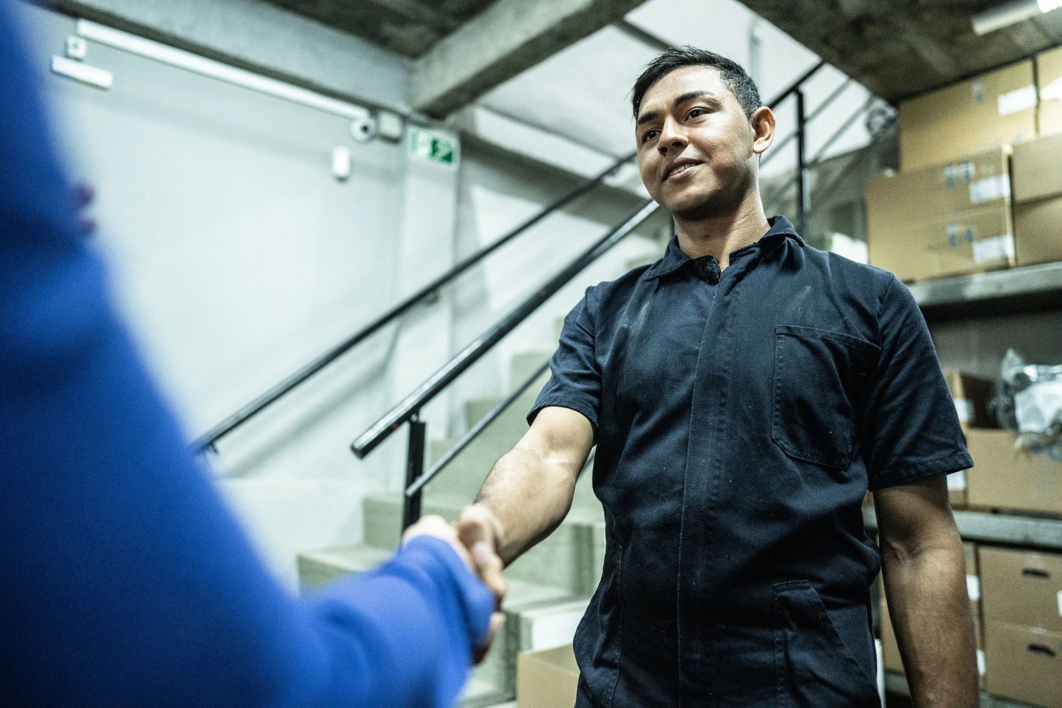Professional logistics partners shaking hands