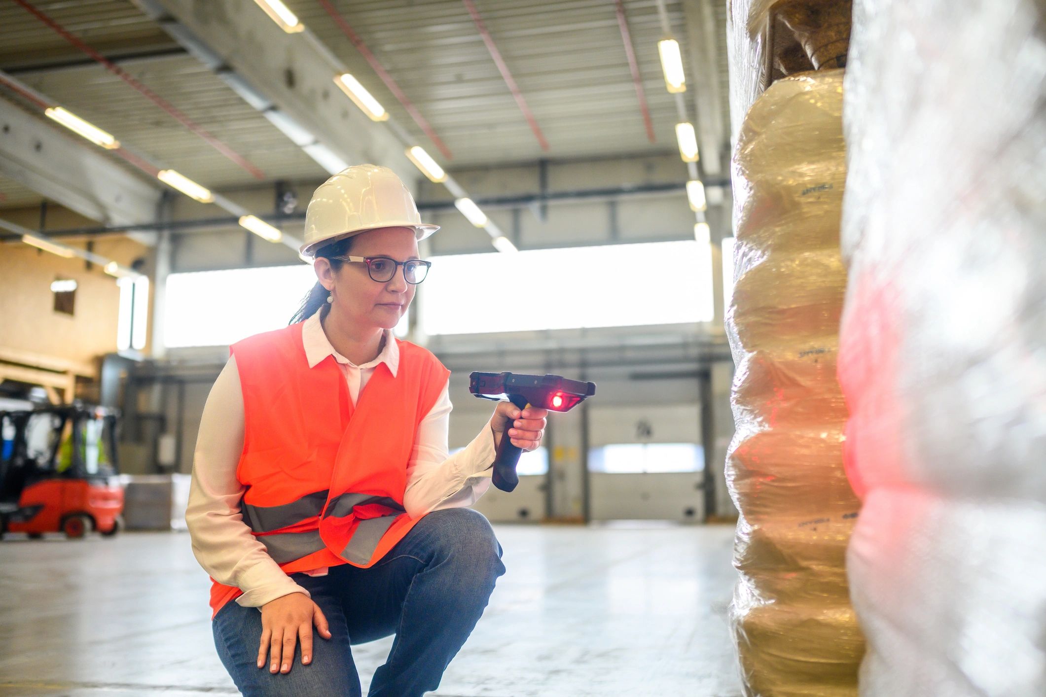 Warehouse worker scanning packages for inventory and dispatch
