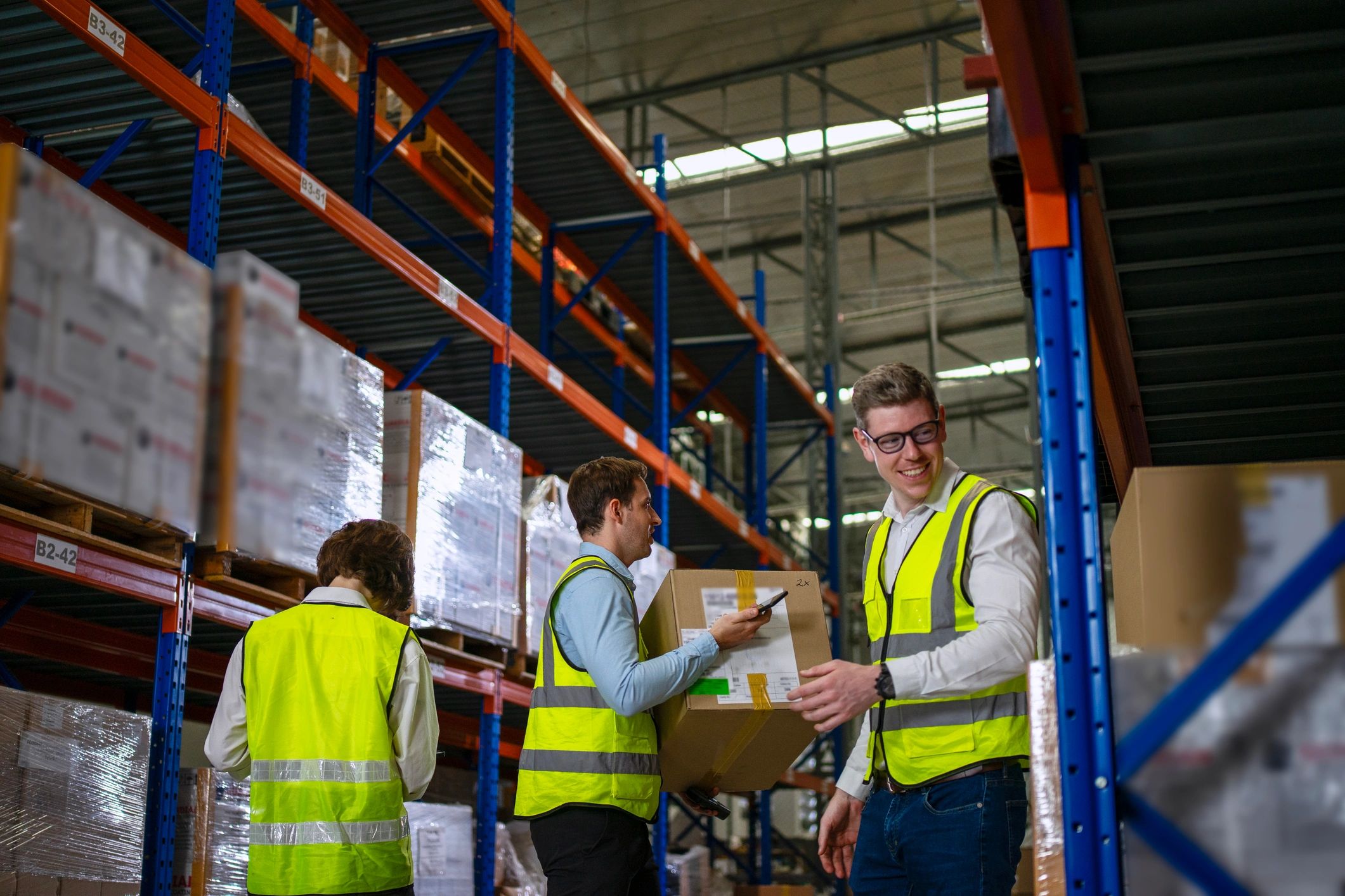 Warehouse team working together to process parcels for shipment